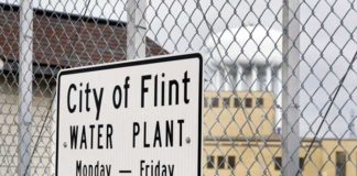 Michigan settles Flint lead water crisis, assures nearly $600M going to affected children Flint Water Treatment Plant sign