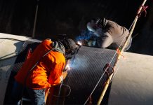 Calgary’s Bearspaw feeder main replacement reaches 80% installation milestone welding water pipe